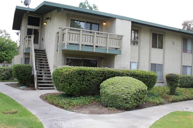 view of property featuring stairs