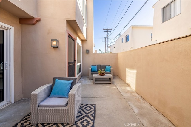 view of patio featuring fence