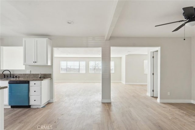 kitchen featuring dishwashing machine, white cabinets, open floor plan, light wood-type flooring, and beam ceiling