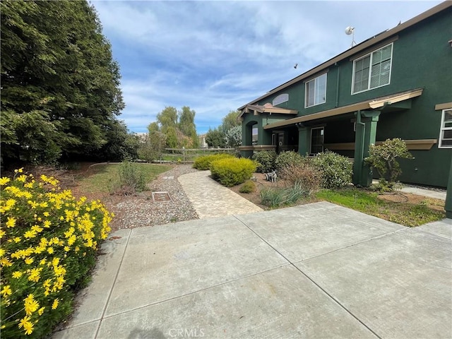 view of yard with a patio and fence