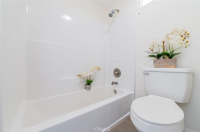 full bathroom with toilet and bathtub / shower combination