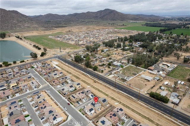 bird's eye view featuring a water and mountain view