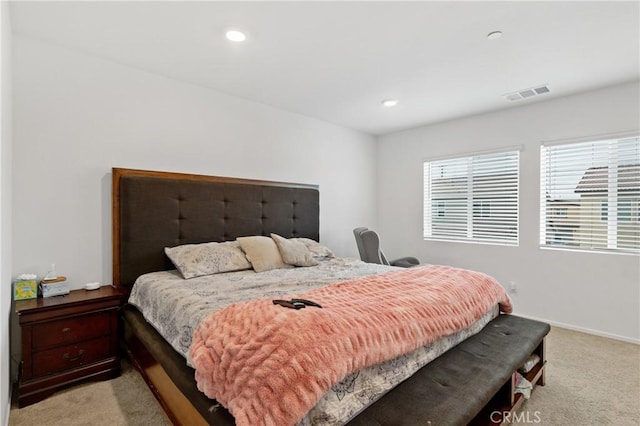 bedroom featuring baseboards, recessed lighting, visible vents, and light colored carpet