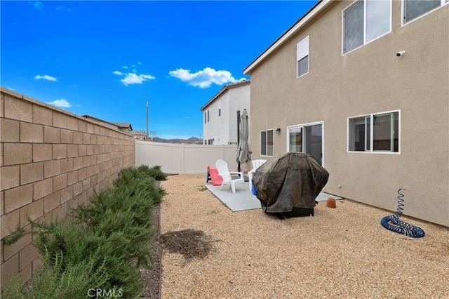 view of yard with a patio area and a fenced backyard