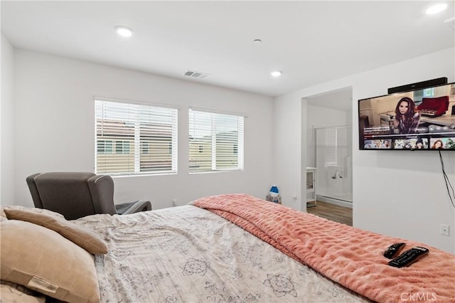 bedroom with recessed lighting and visible vents