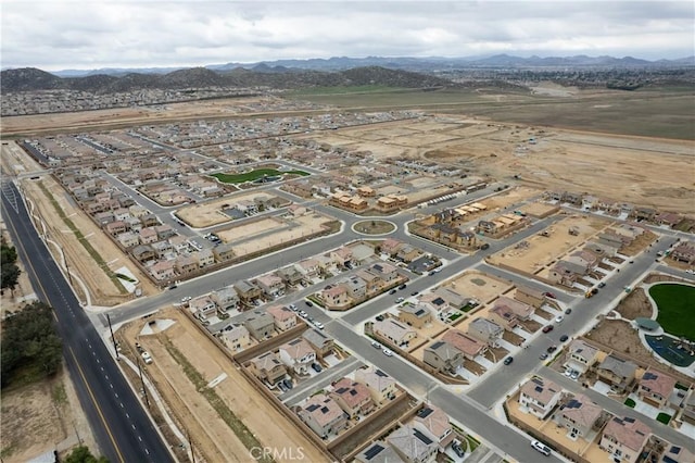 birds eye view of property with a mountain view