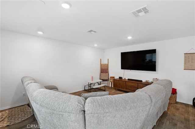 living room featuring recessed lighting, visible vents, and wood finished floors