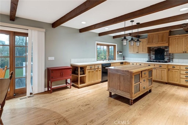 kitchen with open shelves, visible vents, light wood-style floors, black appliances, and decorative light fixtures