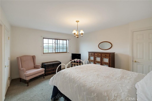 carpeted bedroom with an inviting chandelier