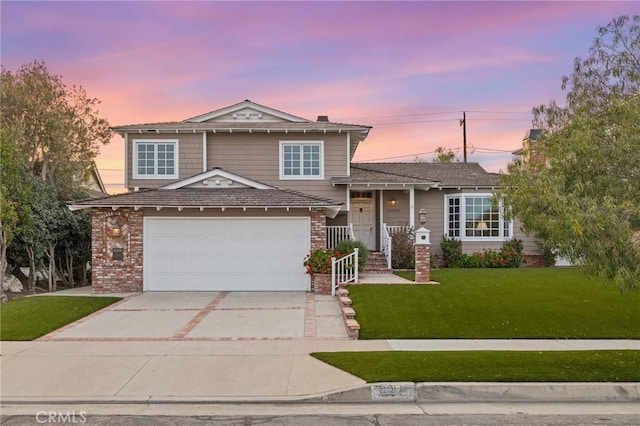 tri-level home with an attached garage, a yard, brick siding, and concrete driveway