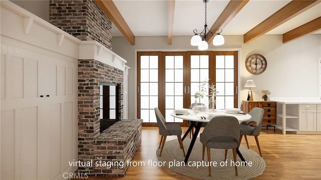 dining space featuring wood finished floors, beamed ceiling, and an inviting chandelier