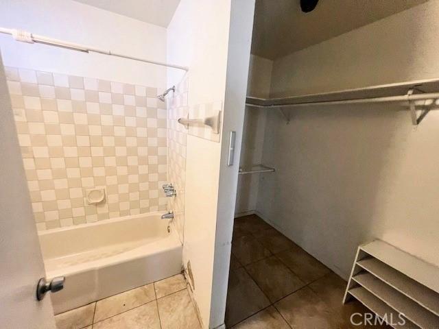 bathroom with shower / bathtub combination and tile patterned flooring