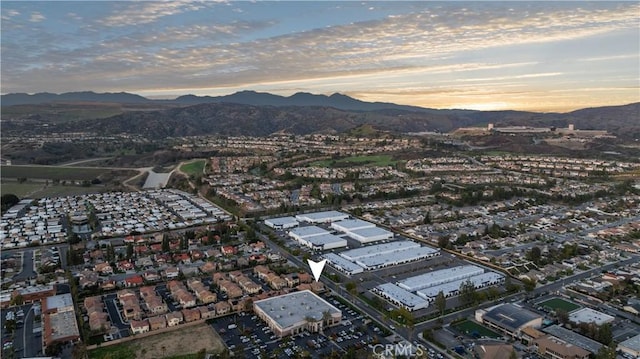 aerial view at dusk with a mountain view