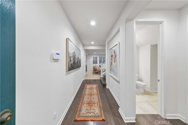 hall with recessed lighting, baseboards, and wood finished floors