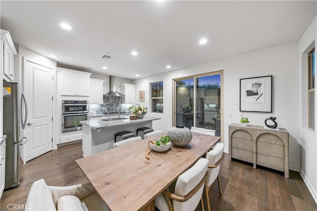 dining space featuring recessed lighting, visible vents, dark wood finished floors, and baseboards