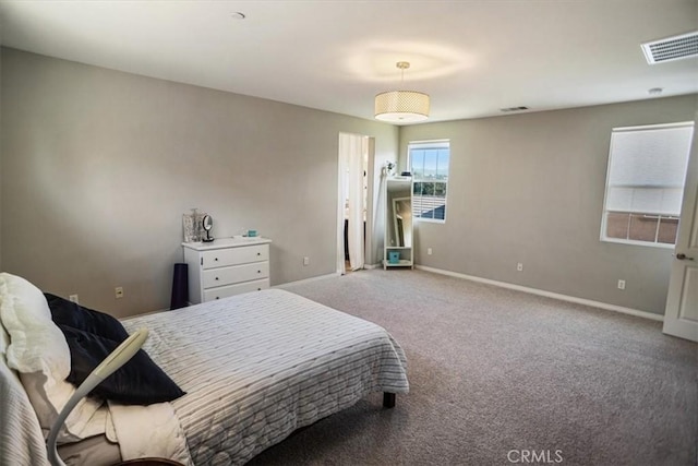 carpeted bedroom with baseboards and visible vents