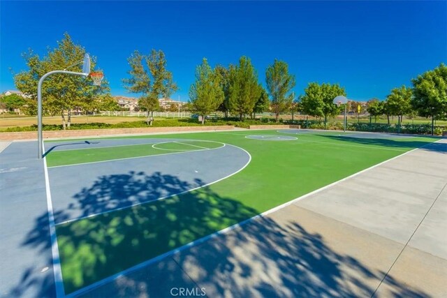 view of basketball court featuring community basketball court and fence