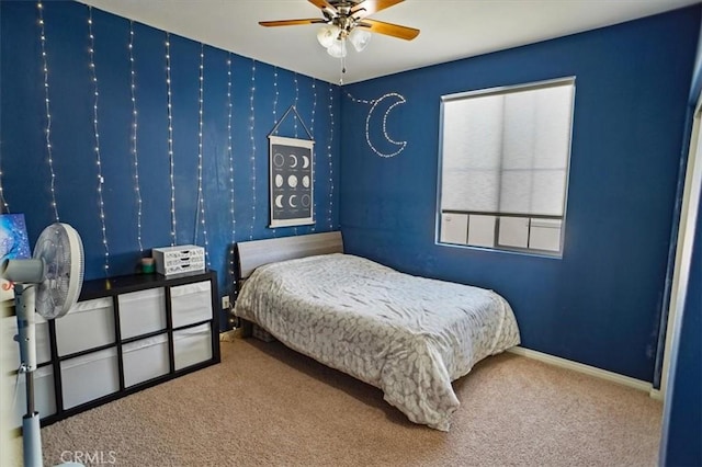 carpeted bedroom with baseboards