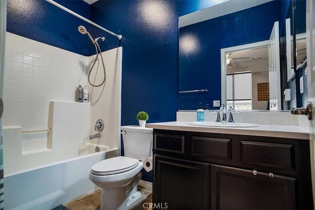 bathroom with vanity, toilet, and bathing tub / shower combination