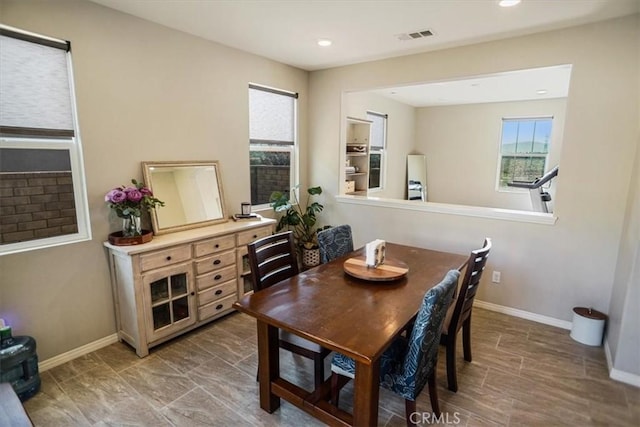 dining room with baseboards, visible vents, and recessed lighting