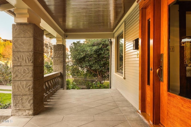 view of patio featuring a porch