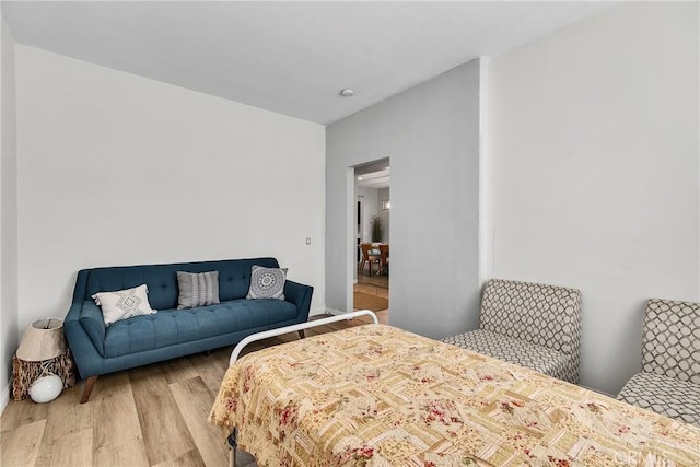 bedroom with wood finished floors