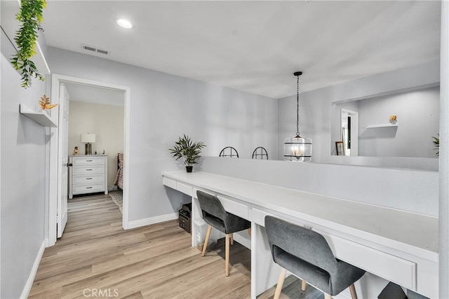 office space with recessed lighting, wood finished floors, visible vents, and baseboards