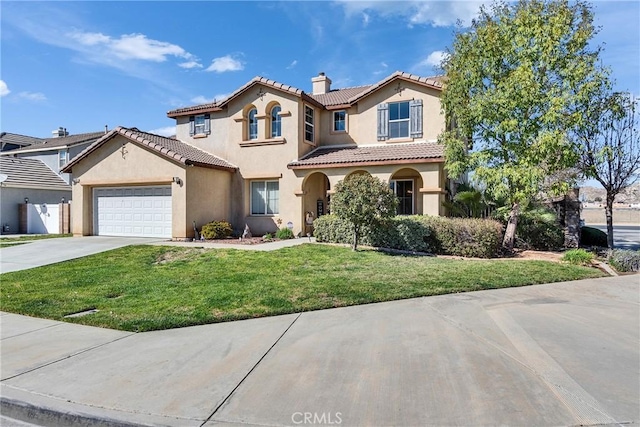 mediterranean / spanish-style home with a chimney, stucco siding, concrete driveway, a front yard, and a tiled roof