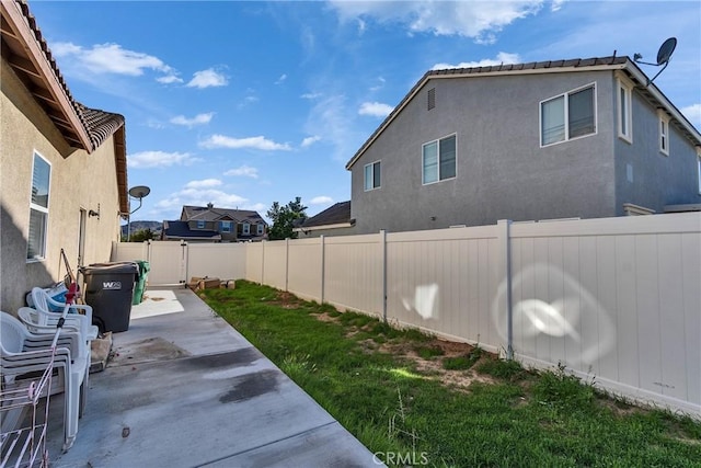 view of yard featuring a fenced backyard and a patio