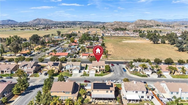 drone / aerial view featuring a residential view and a mountain view