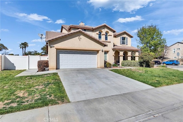 mediterranean / spanish house with stucco siding, fence, a front lawn, and a tiled roof