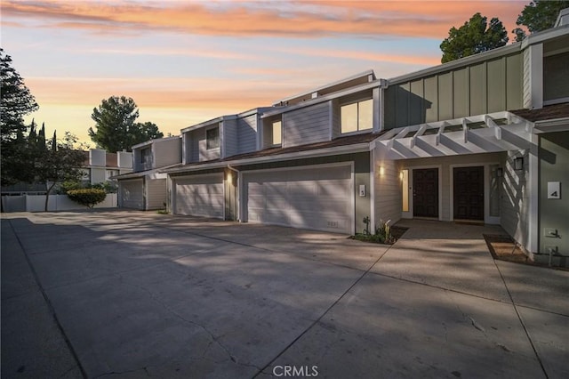 view of front of property featuring an attached garage and driveway