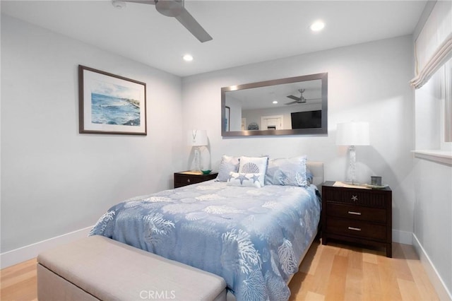 bedroom featuring a ceiling fan, recessed lighting, wood finished floors, and baseboards