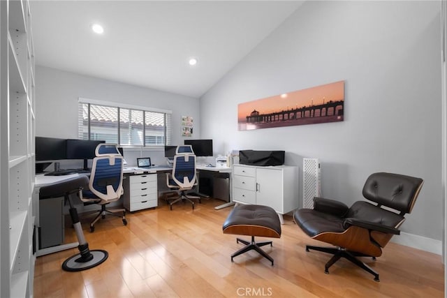 office area with recessed lighting, light wood-style flooring, and high vaulted ceiling