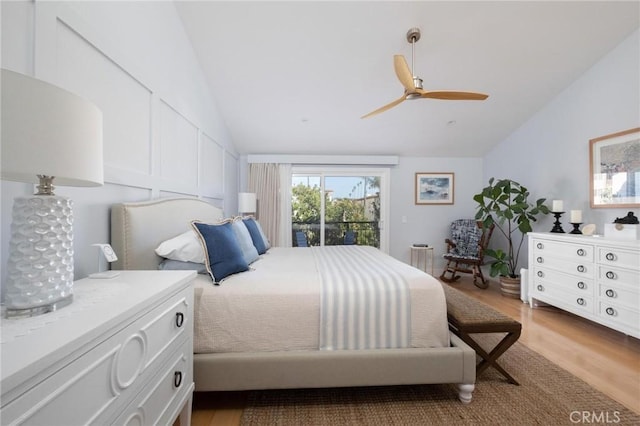 bedroom featuring ceiling fan, lofted ceiling, light wood-style flooring, and access to outside