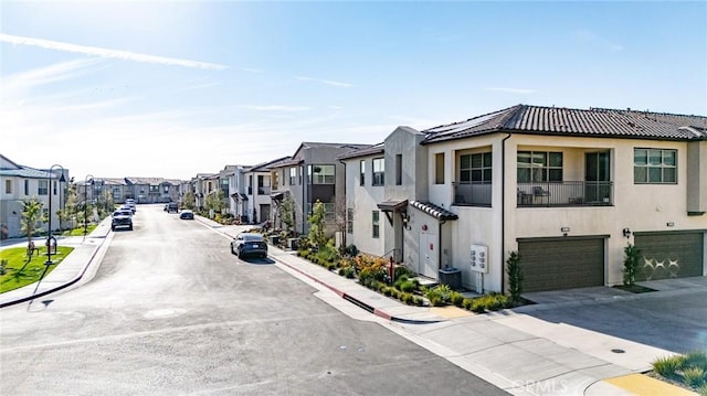 view of road with a residential view, curbs, and sidewalks