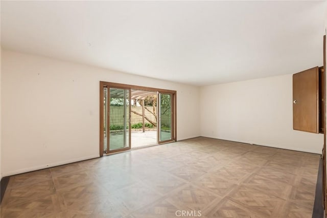 empty room with baseboards