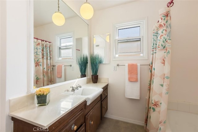 bathroom featuring vanity and baseboards