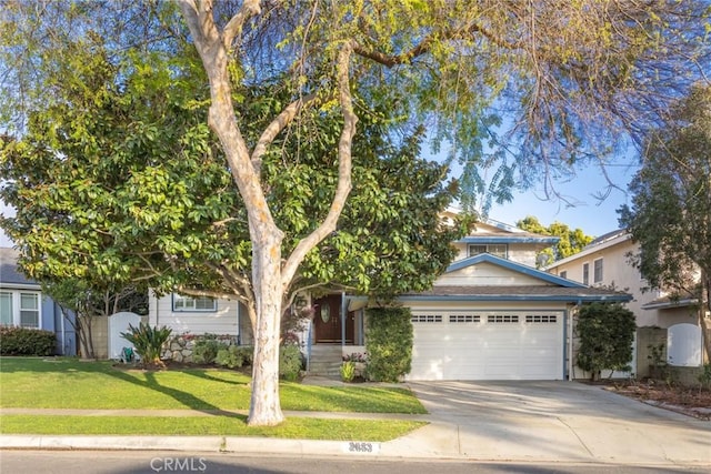 obstructed view of property with a garage, concrete driveway, and a front lawn