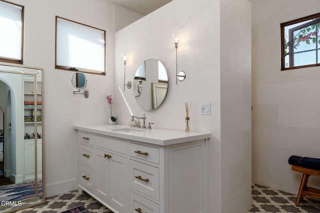 full bathroom with vanity and walk in shower