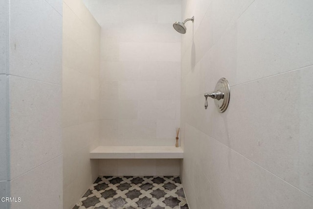 bathroom featuring tiled shower