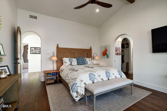 bedroom featuring arched walkways, visible vents, ceiling fan, wood finished floors, and baseboards