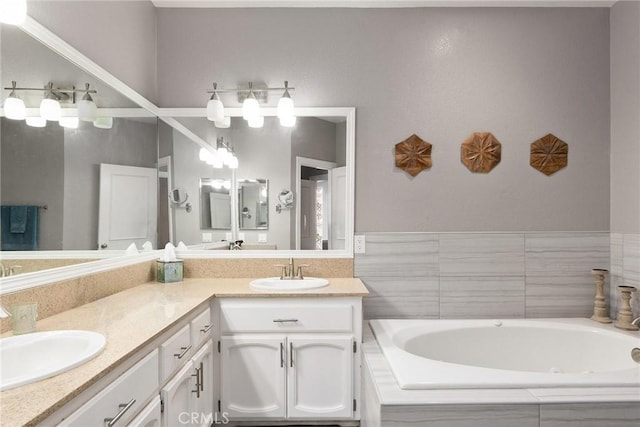 bathroom featuring double vanity, a sink, and a bath