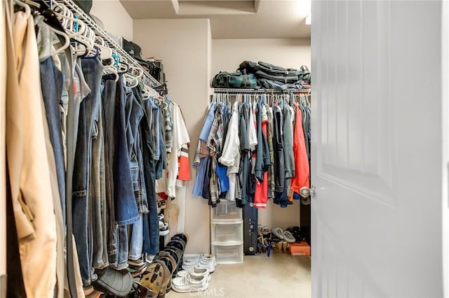 walk in closet featuring attic access