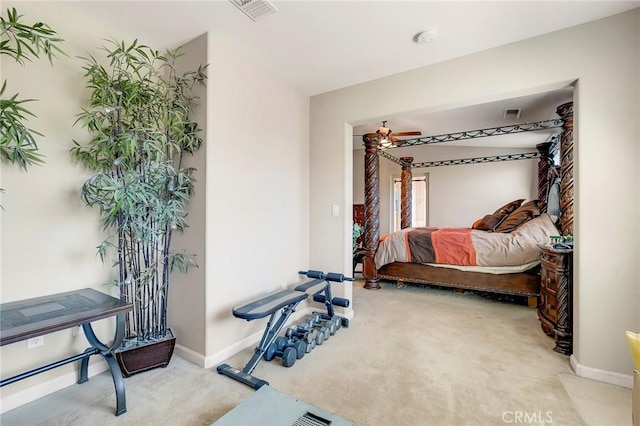 carpeted bedroom featuring baseboards and visible vents