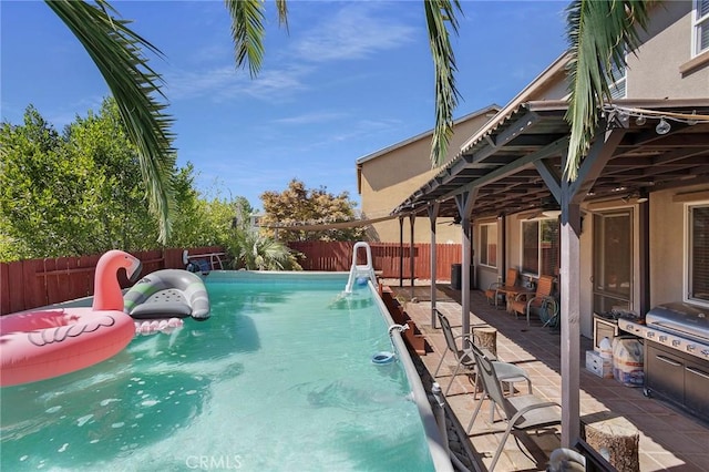 view of swimming pool featuring a fenced backyard and a fenced in pool