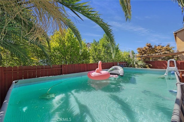 view of pool featuring a fenced backyard