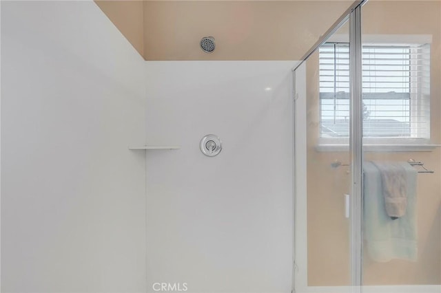 full bath with a shower with shower door