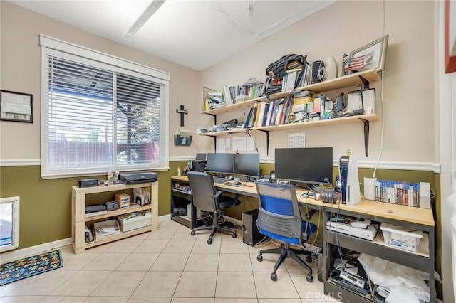 office featuring baseboards and light tile patterned flooring