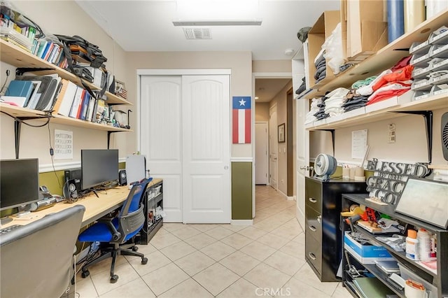 office area featuring visible vents and light tile patterned flooring